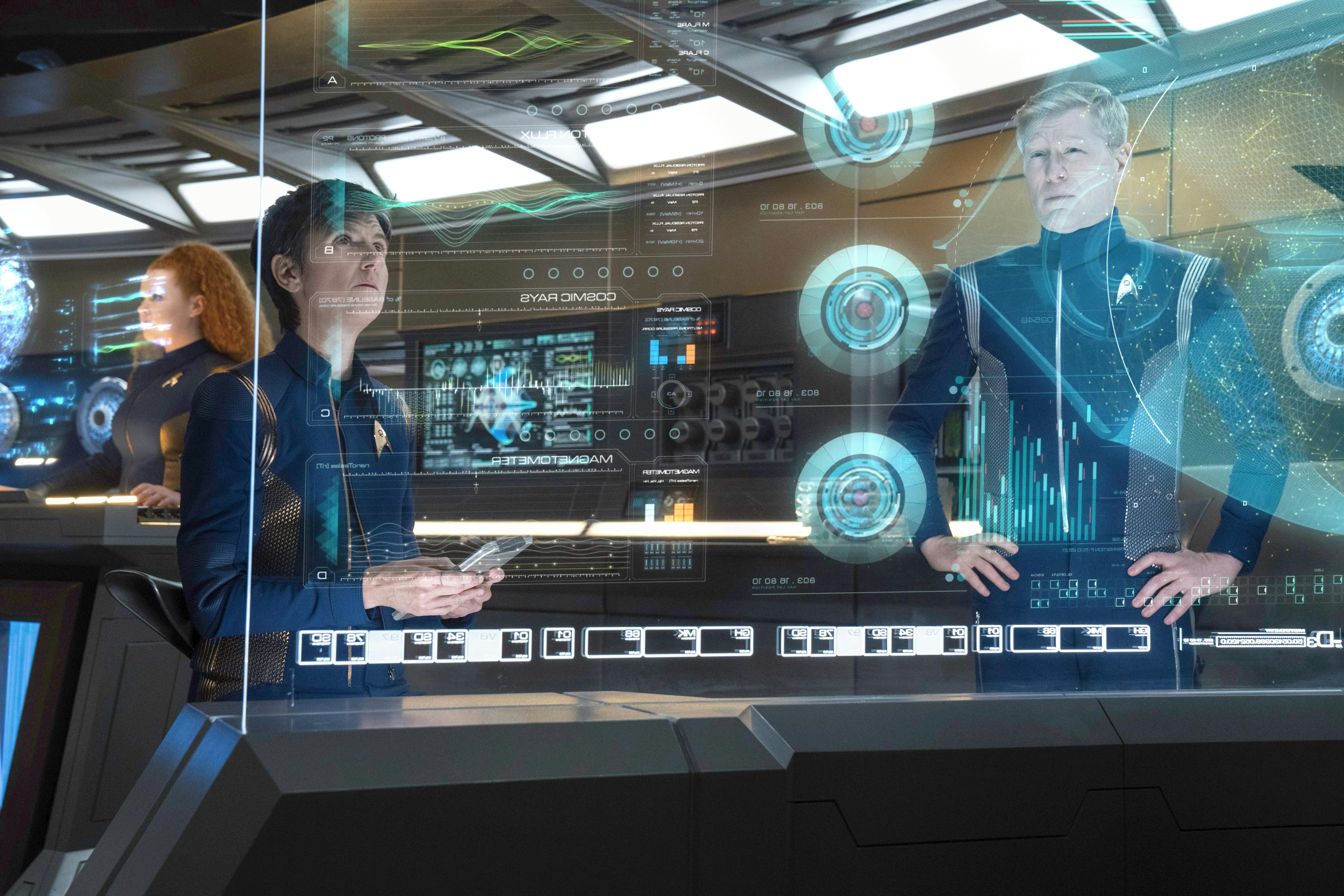 Jett Reno and Paul Stamets review data on a monitor in 'Die Trying'